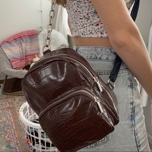 Brown snakeskin mini backpack